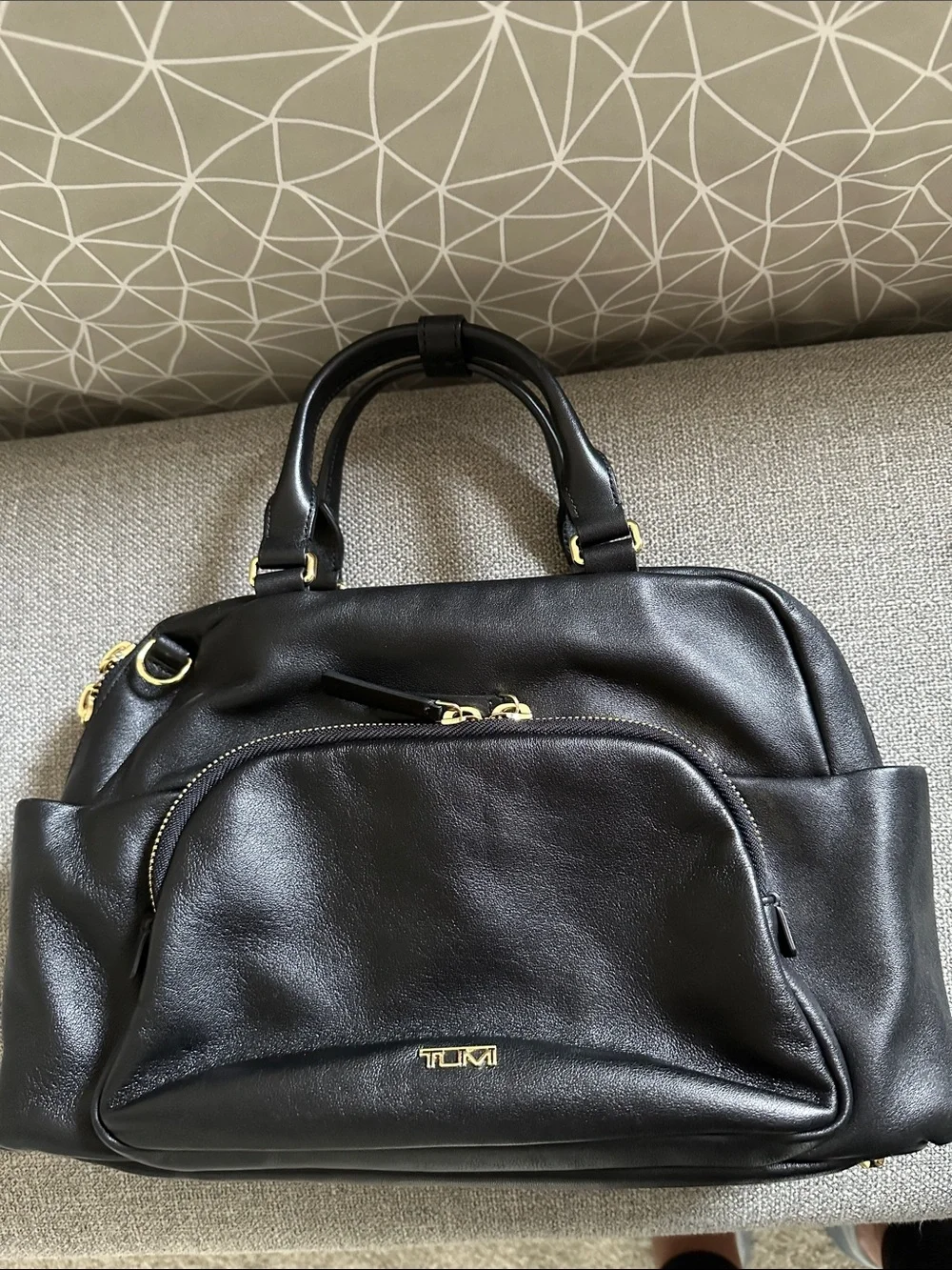 Tumi Leather Adrian Voyageur with Gold Hardware